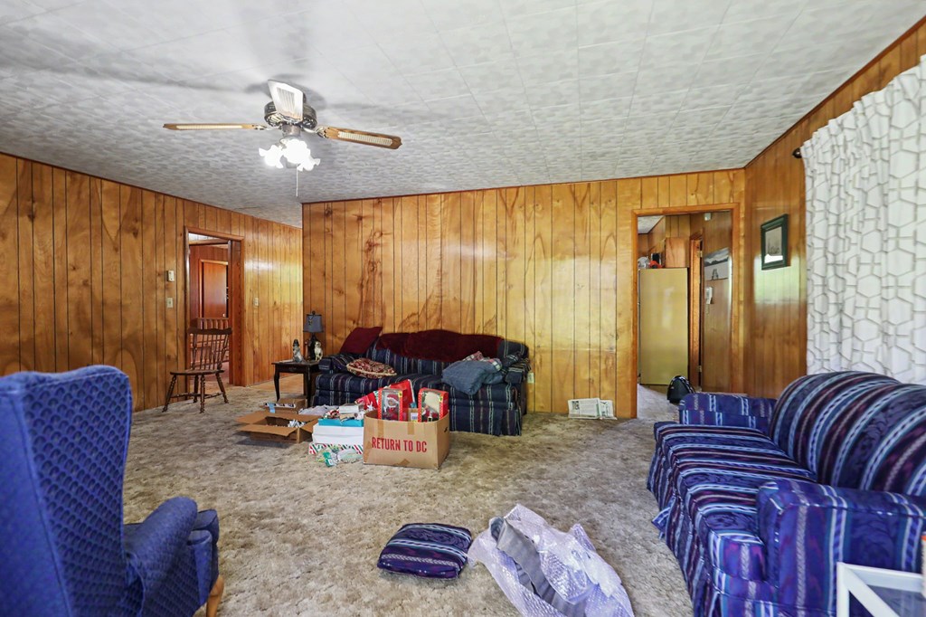 63 Fort Butler Street Murphy, NC 28906 - Photo 7 of 30 a living room with furniture and a chandelier