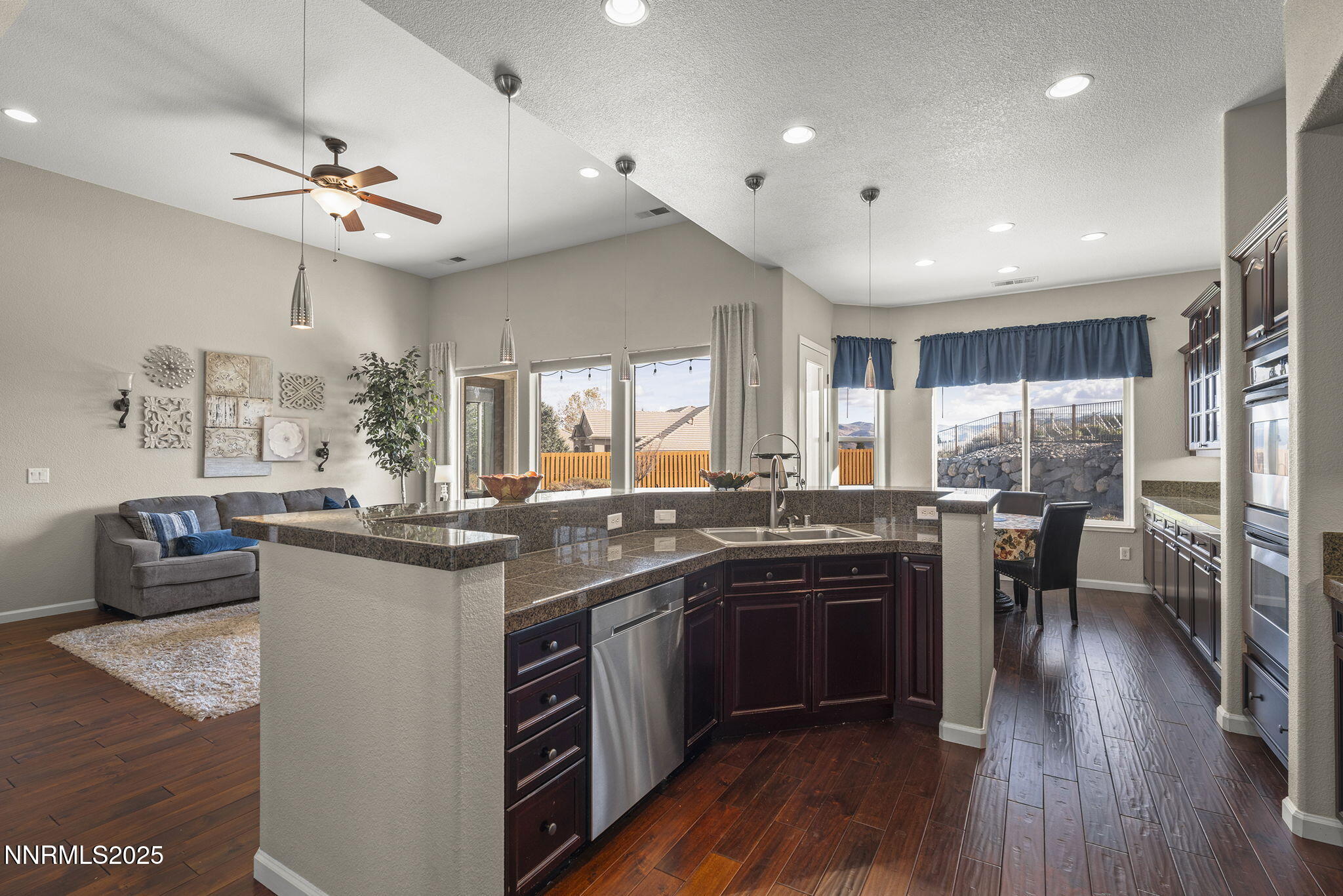 5502 New Mexico Court Reno, NV 89511 - Photo 14 of 55 a kitchen with lots of counter top space and dining table