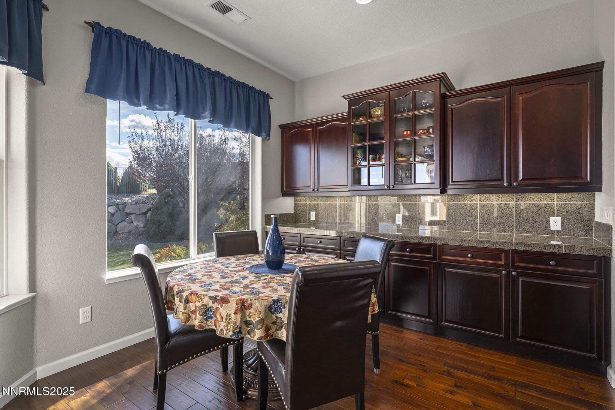 5502 New Mexico Court Reno, NV 89511 - Photo 17 of 55 a kitchen with stainless steel appliances granite countertop wooden cabinets a stove top oven a sink and dishwasher