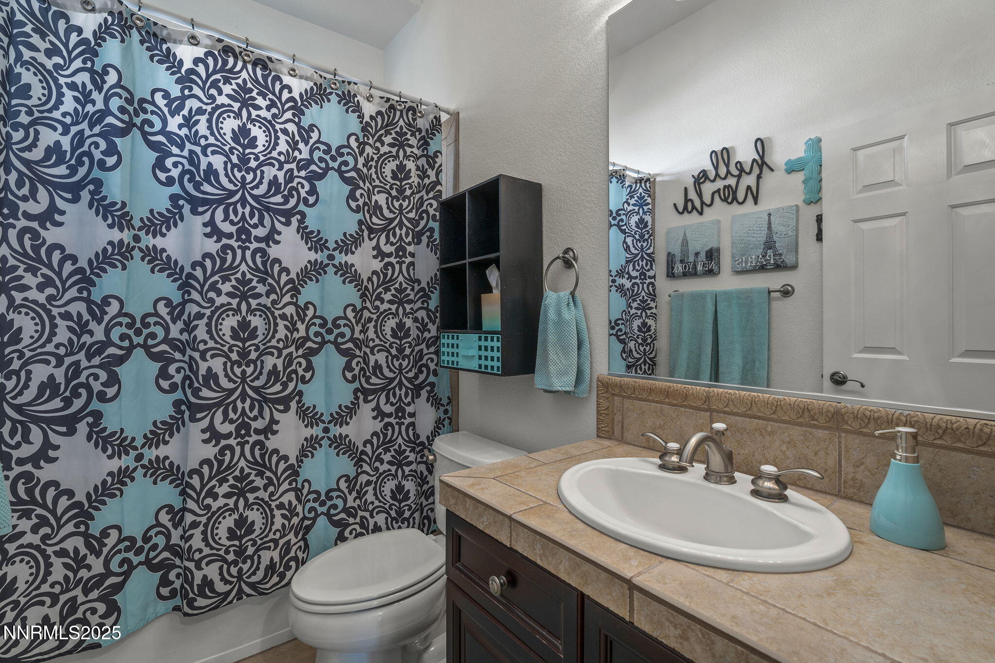 5502 New Mexico Court Reno, NV 89511 - Photo 24 of 55 a bathroom with a sink toilet and shower