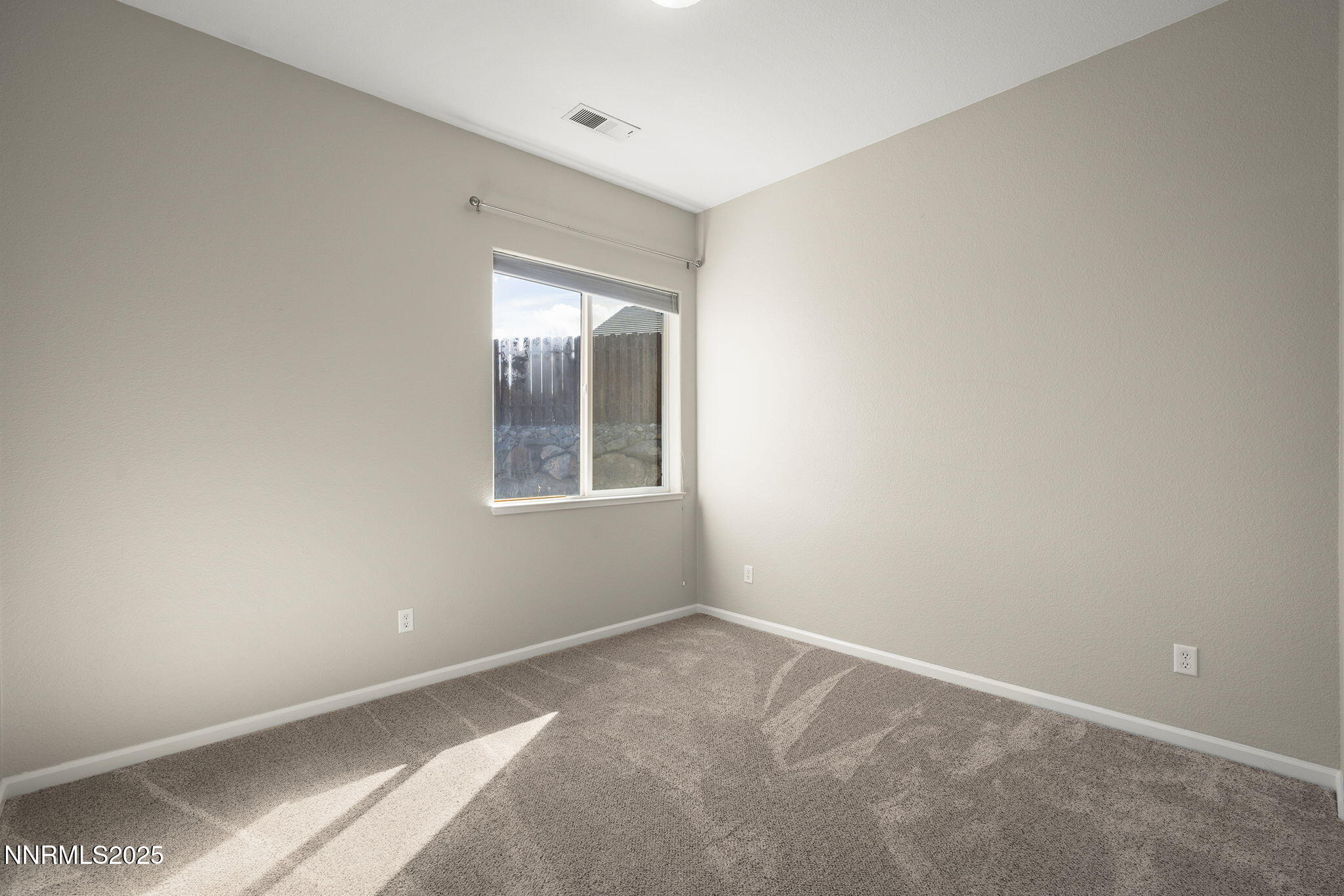 5502 New Mexico Court Reno, NV 89511 - Photo 31 of 55 a view of an empty room with a window