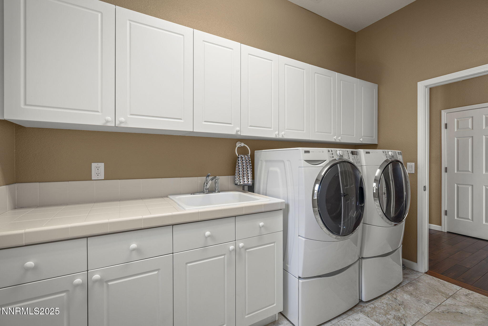 5502 New Mexico Court Reno, NV 89511 - Photo 33 of 55 a utility room with dryer and washer