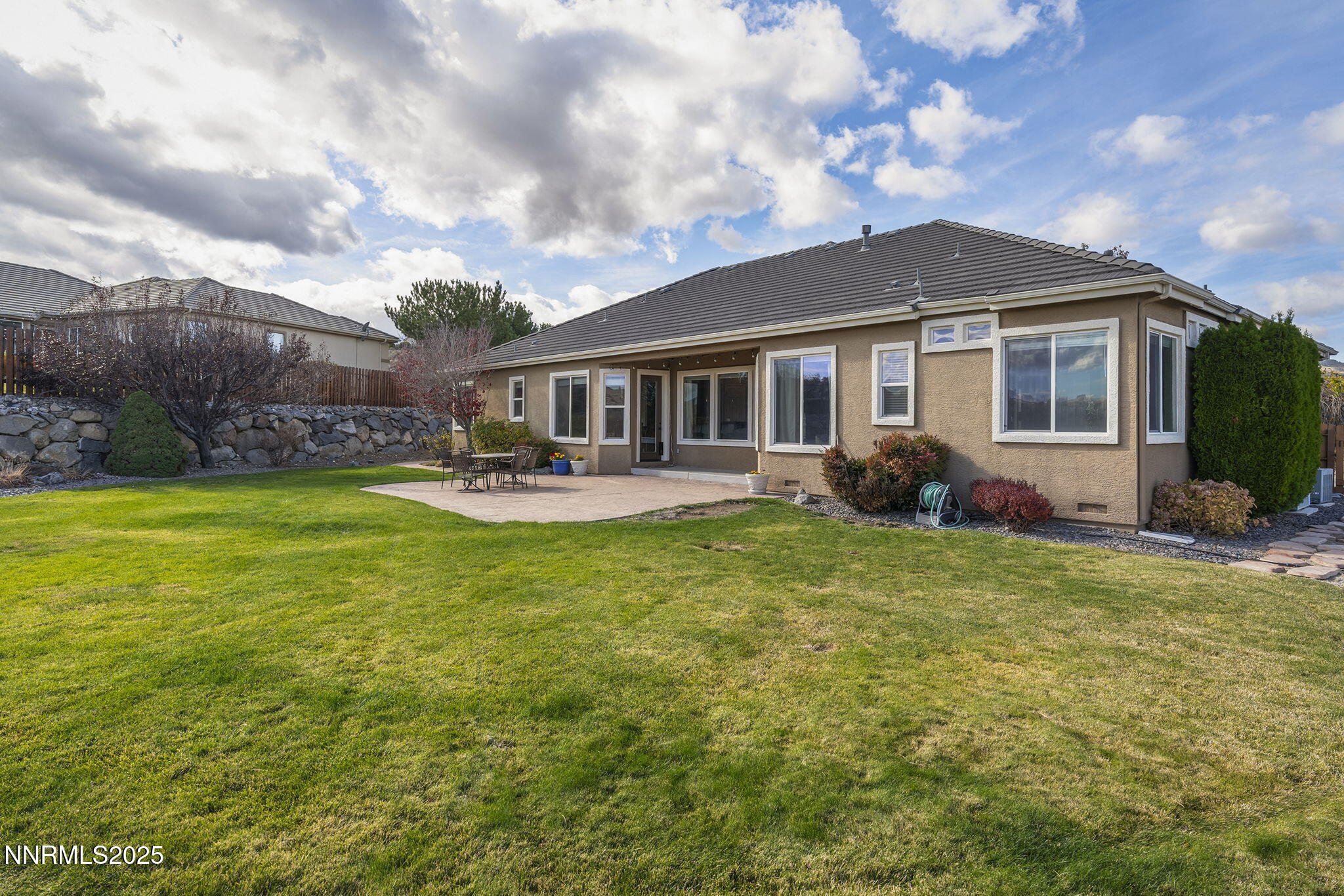 5502 New Mexico Court Reno, NV 89511 - Photo 40 of 55 a front view of a house with garden