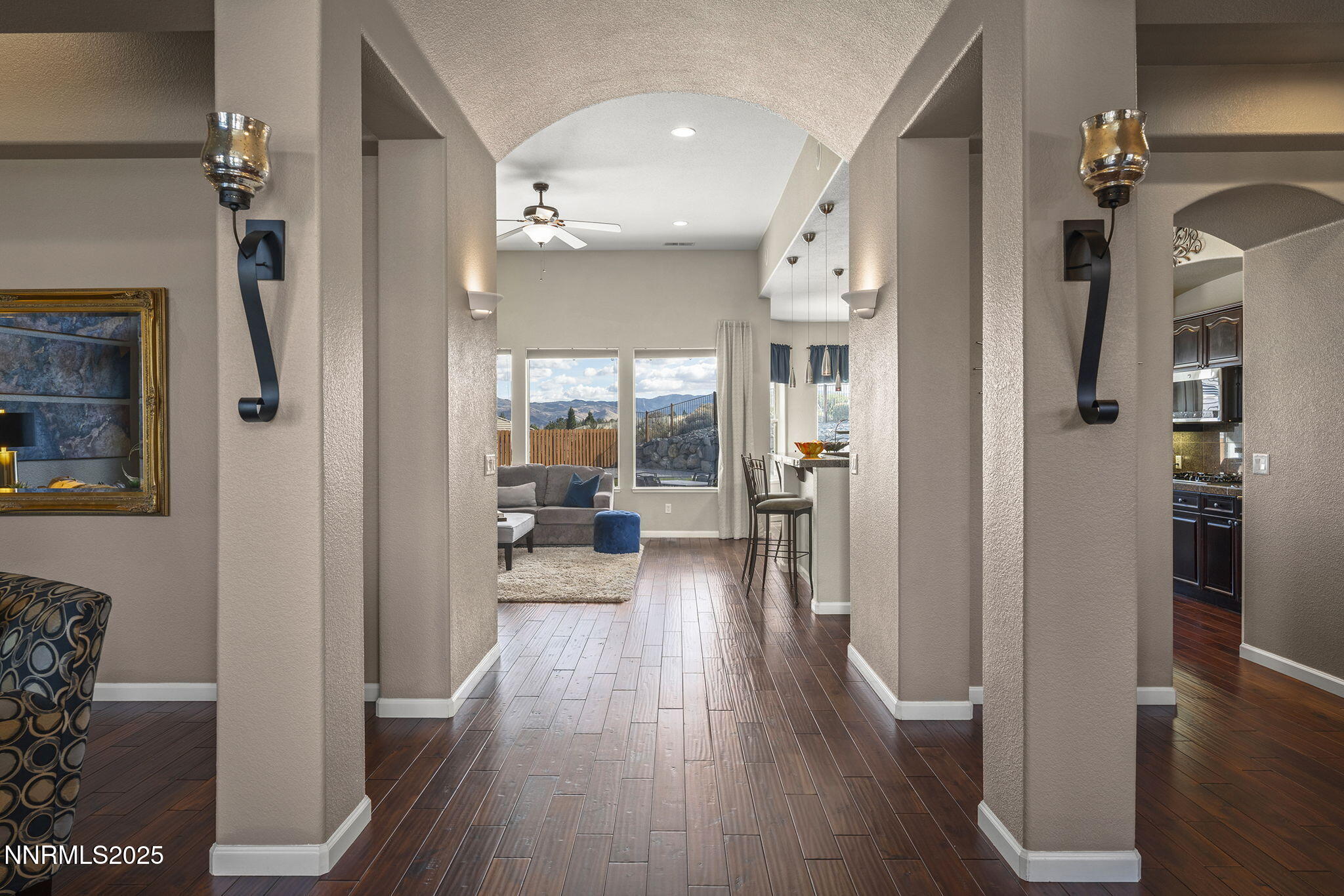 5502 New Mexico Court Reno, NV 89511 - Photo 4 of 55 a view of a hallway with wooden floor fireplace and living room