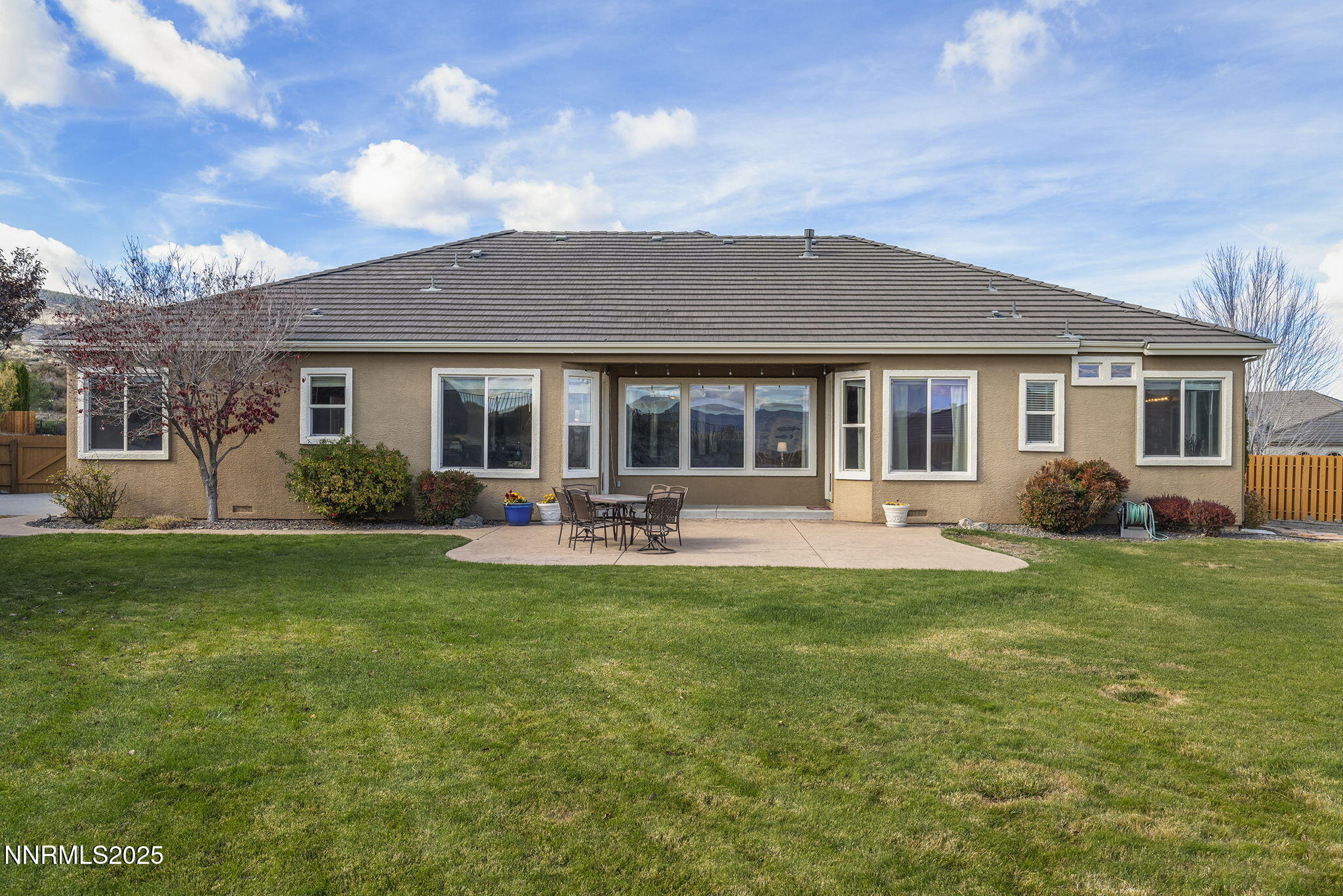 5502 New Mexico Court Reno, NV 89511 - Photo 42 of 55 a front view of house with yard and green space