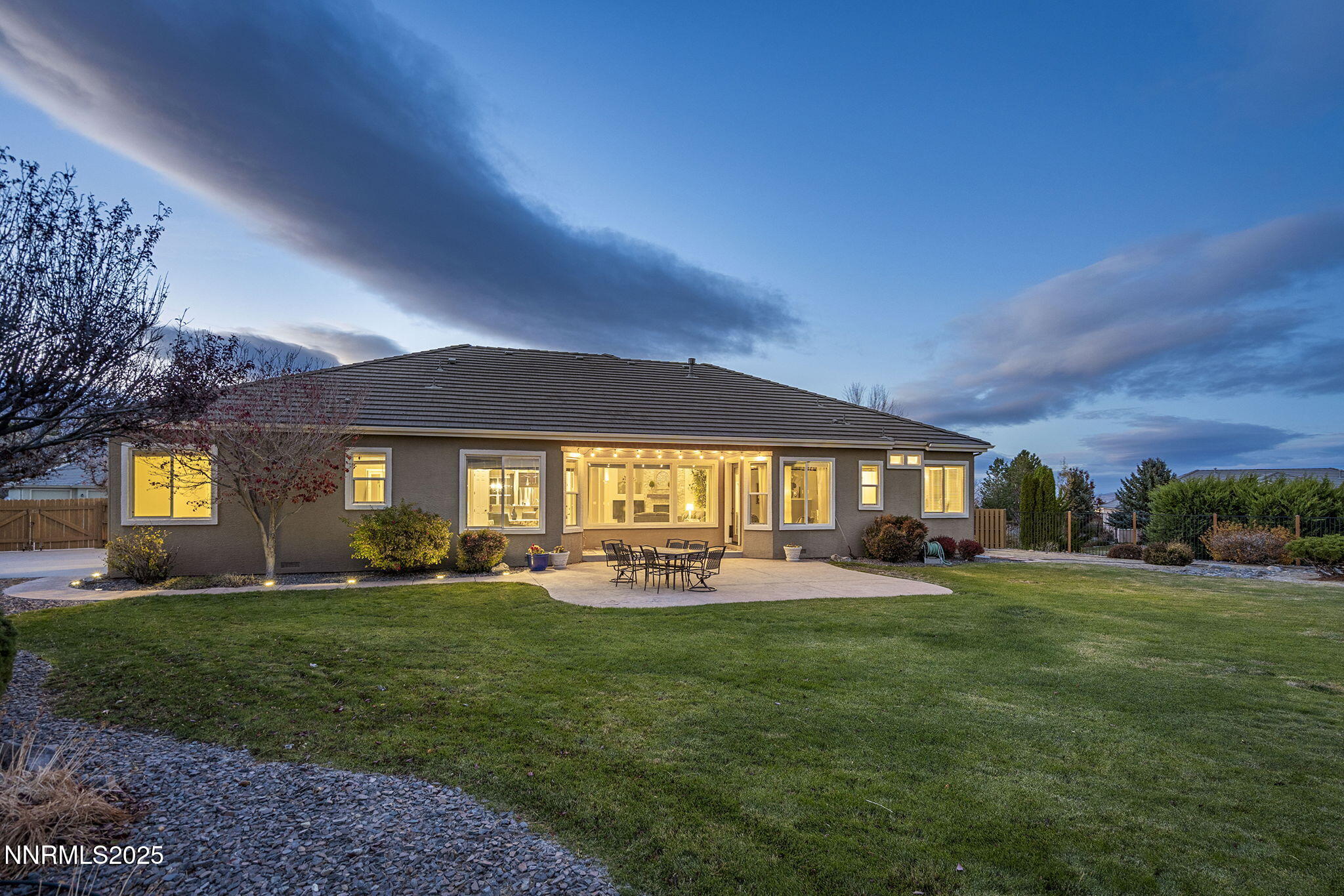 5502 New Mexico Court Reno, NV 89511 - Photo 43 of 55 a front view of a house with a yard and trees