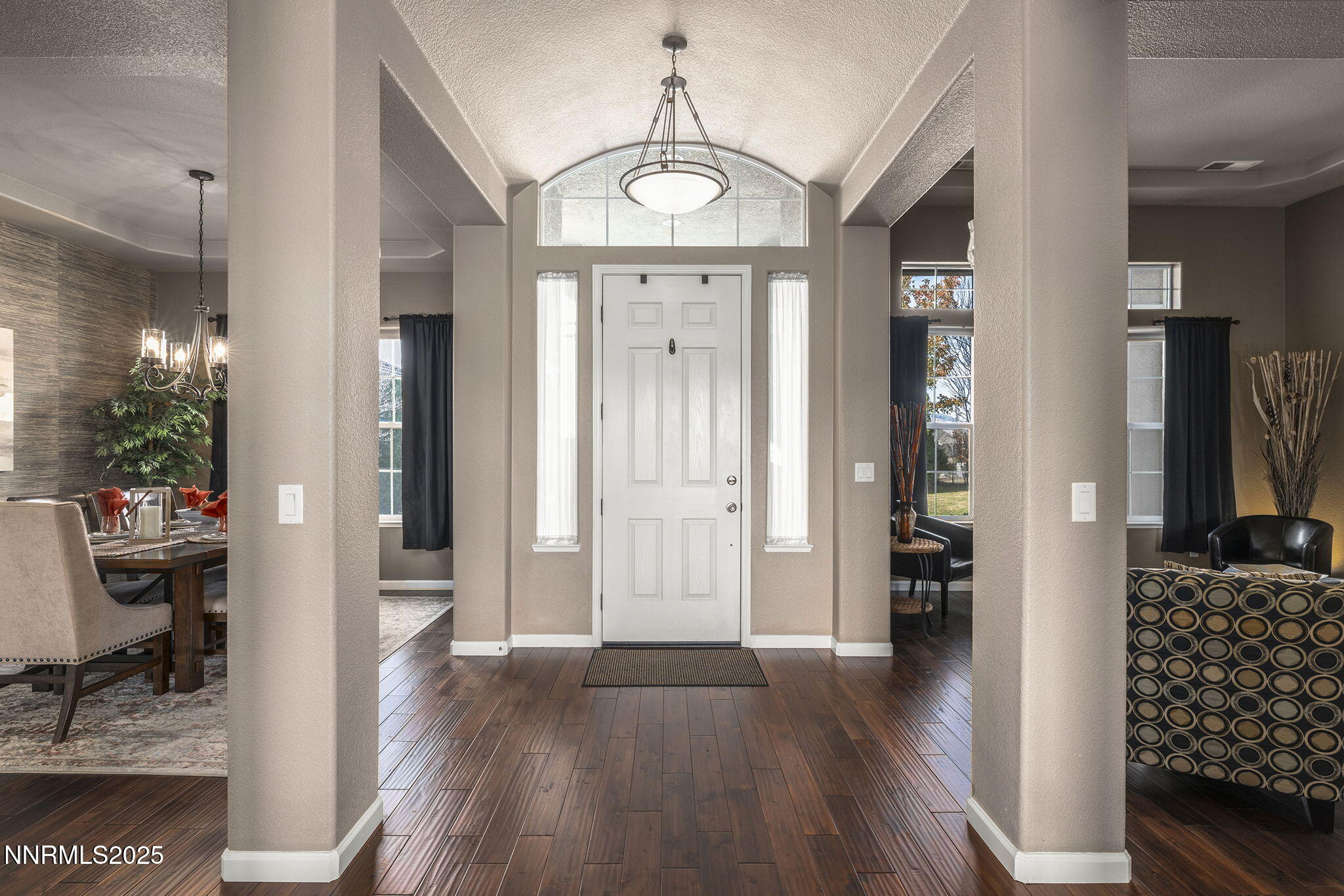 5502 New Mexico Court Reno, NV 89511 - Photo 5 of 55 a view of a hallway with wooden floor windows and livingroom