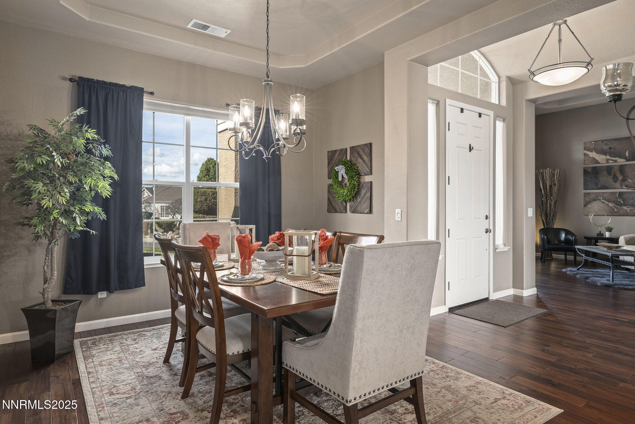 5502 New Mexico Court Reno, NV 89511 - Photo 8 of 55 a view of a dining room with furniture and wooden floor