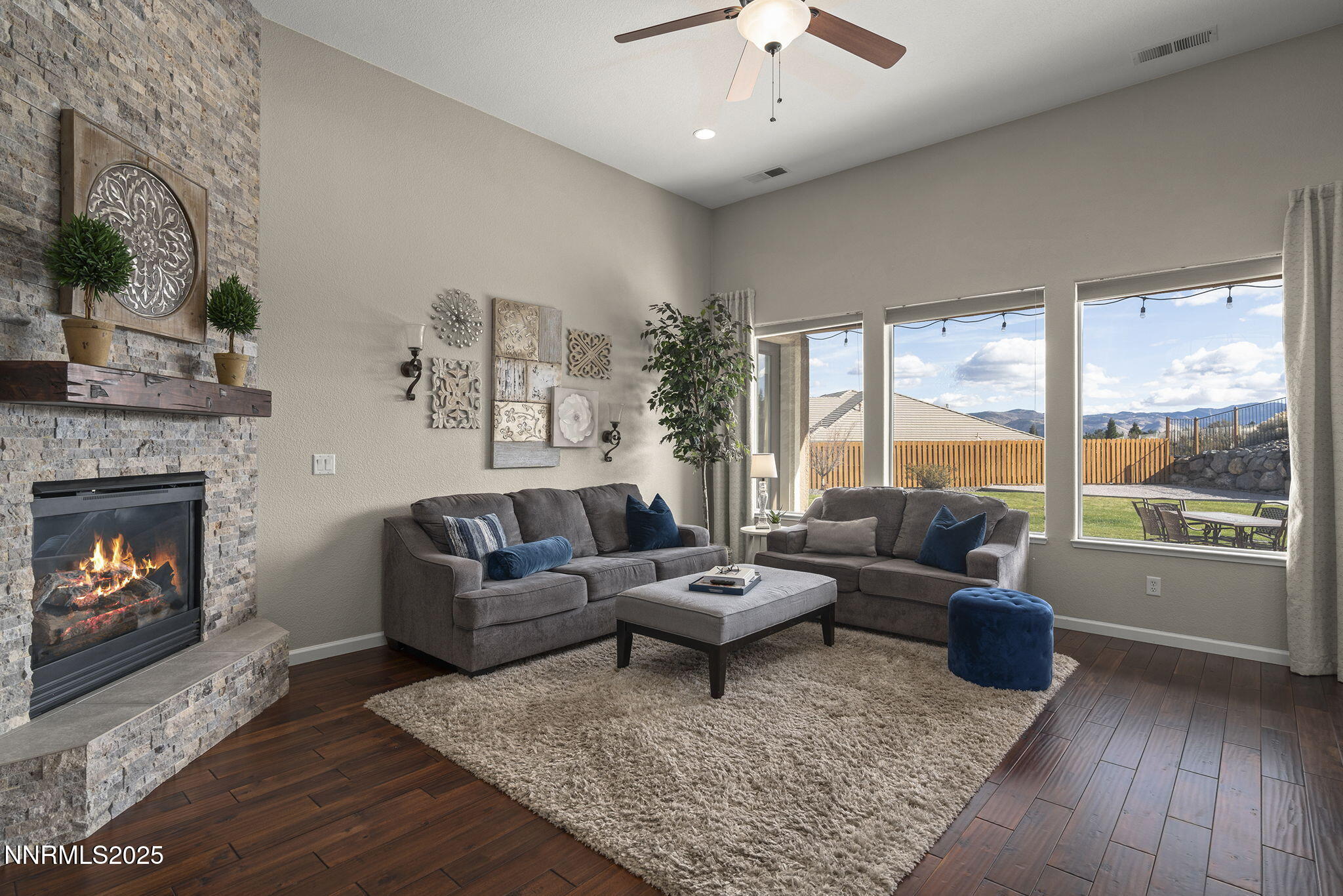 5502 New Mexico Court Reno, NV 89511 - Photo 9 of 55 a living room with furniture and a fireplace