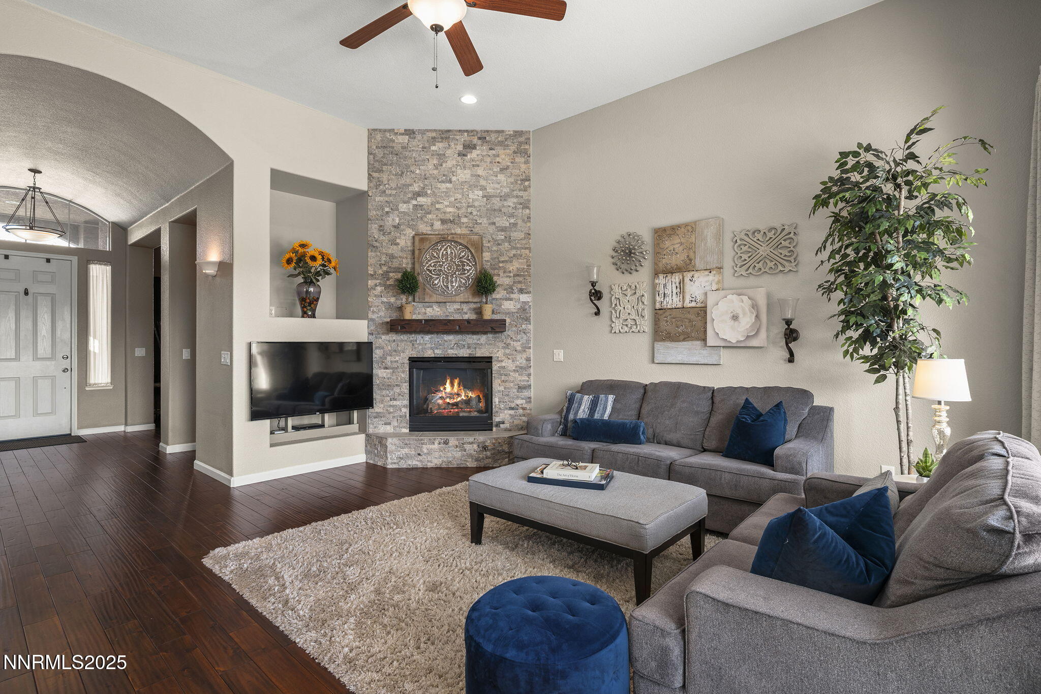 5502 New Mexico Court Reno, NV 89511 - Photo 10 of 55 a living room with furniture and a fireplace