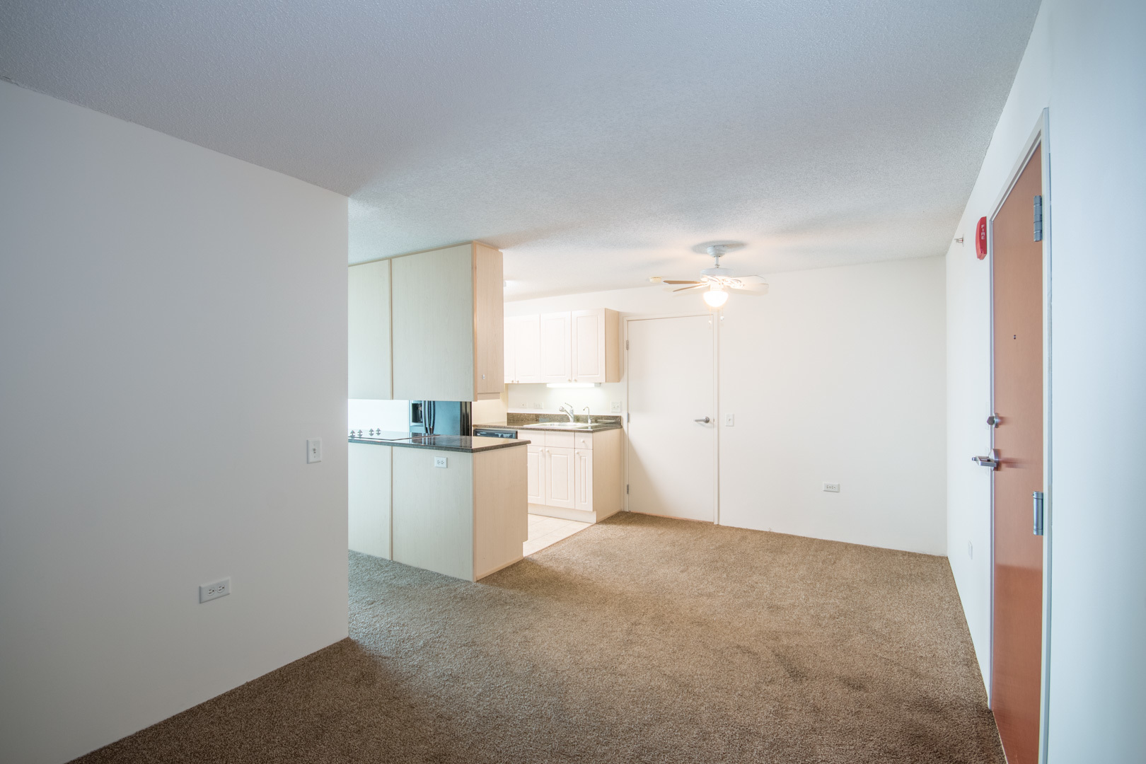 800 Elgin Road, Unit 1206 Evanston, IL 60201 - Photo 11 of 18 a view of a kitchen with a sink and dishwasher a refrigerator with white cabinets