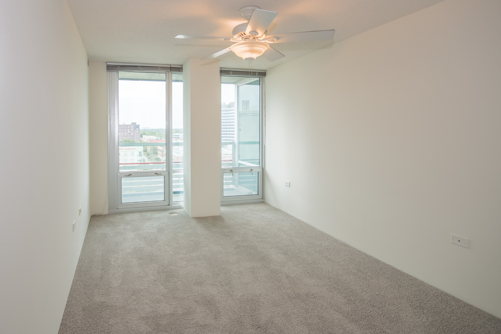 800 Elgin Road, Unit 1206 Evanston, IL 60201 - Photo 13 of 18 an empty room with windows and closet