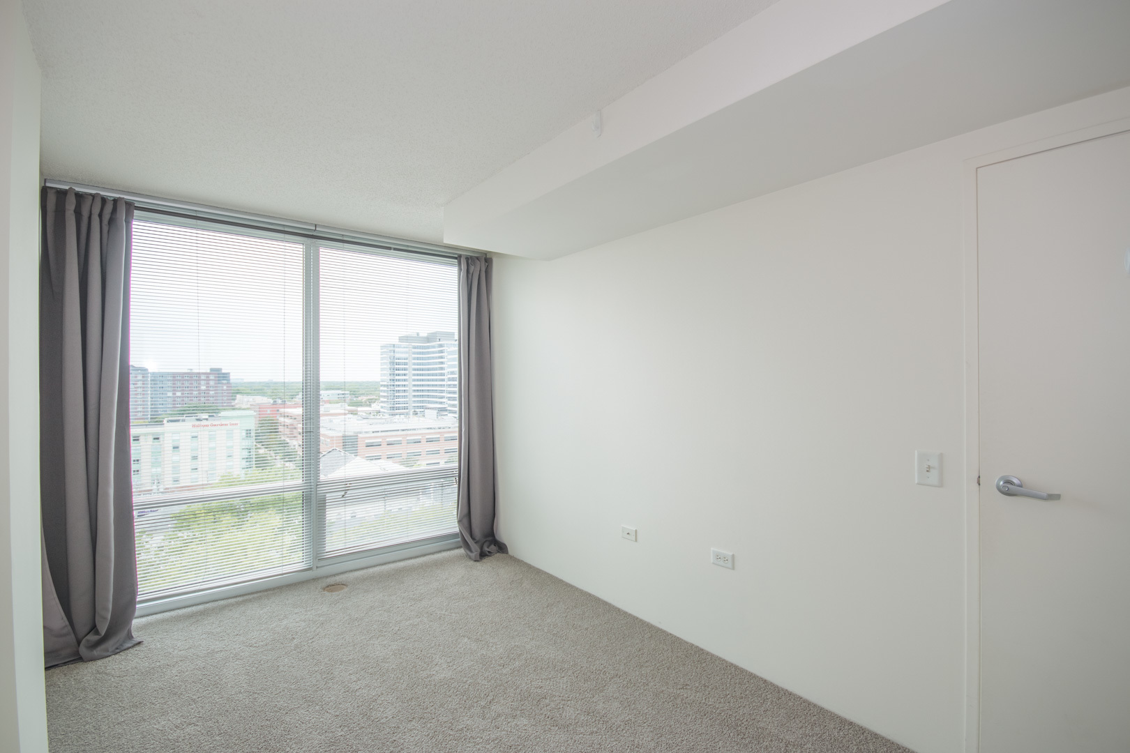 800 Elgin Road, Unit 1206 Evanston, IL 60201 - Photo 14 of 18 a view of an empty room with a window