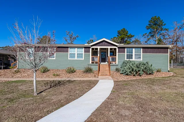 a front view of a house with a porch
