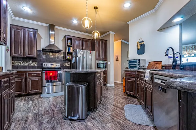 a bathroom with a sink a mirror and a shower