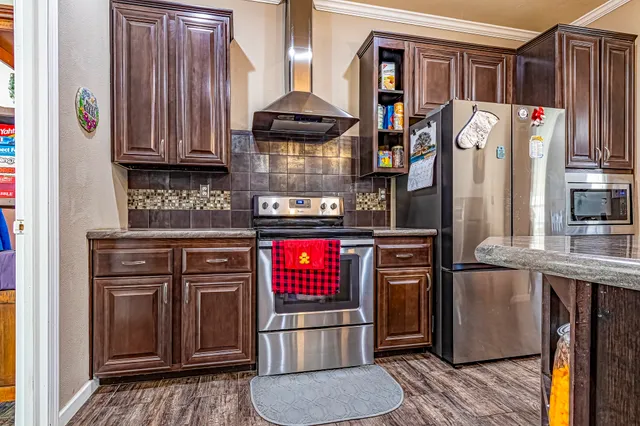 a spacious bathroom with a granite countertop sink and a mirror