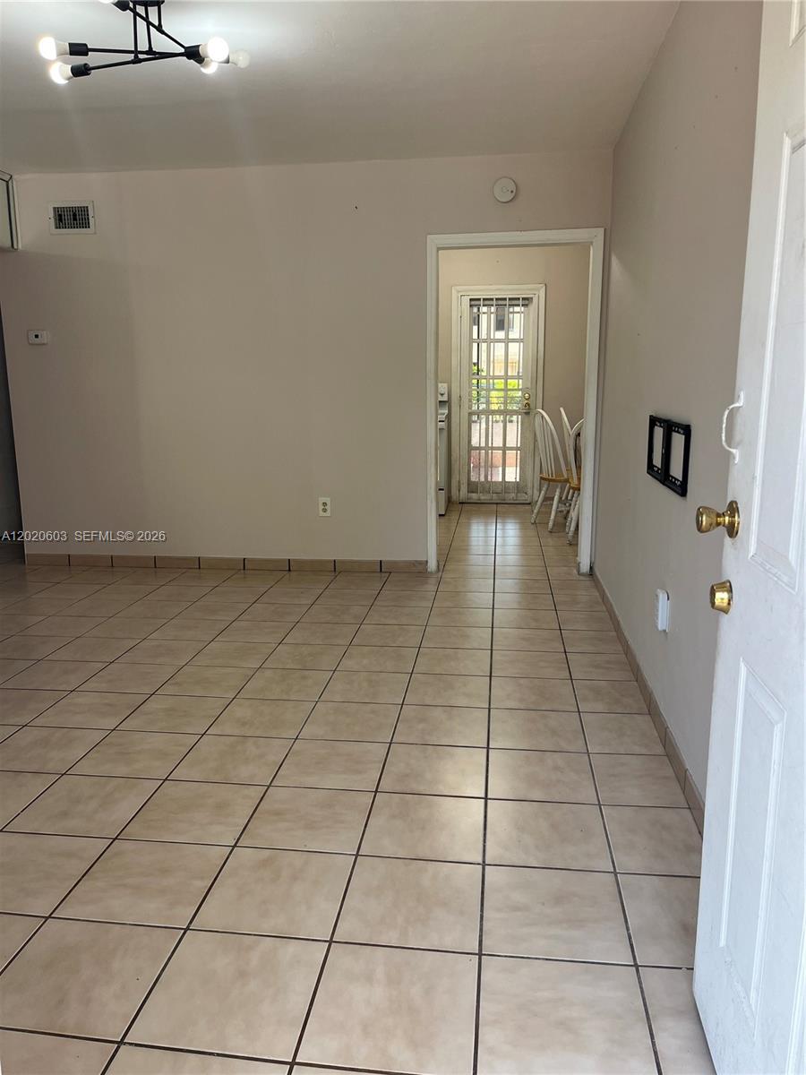 3750 Southwest 27th Street Miami, FL 33134 - Photo 3 of 4 a hallway with a window