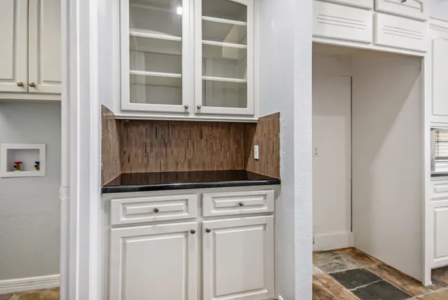 a view of cabinets and window