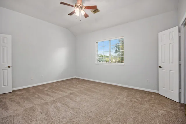 a view of an empty room with a window