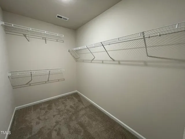 a bathroom with a granite countertop sink and a bathtub