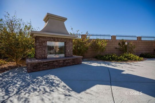 2401 Lacey Street Ridgecrest, CA 93555 - Photo 39 of 44 a front view of a house with a yard