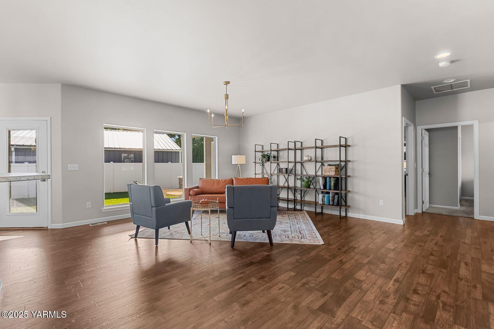 115 Apple Loop Naches, WA 98937 - Photo 11 of 48 a living room with furniture and a wooden floor