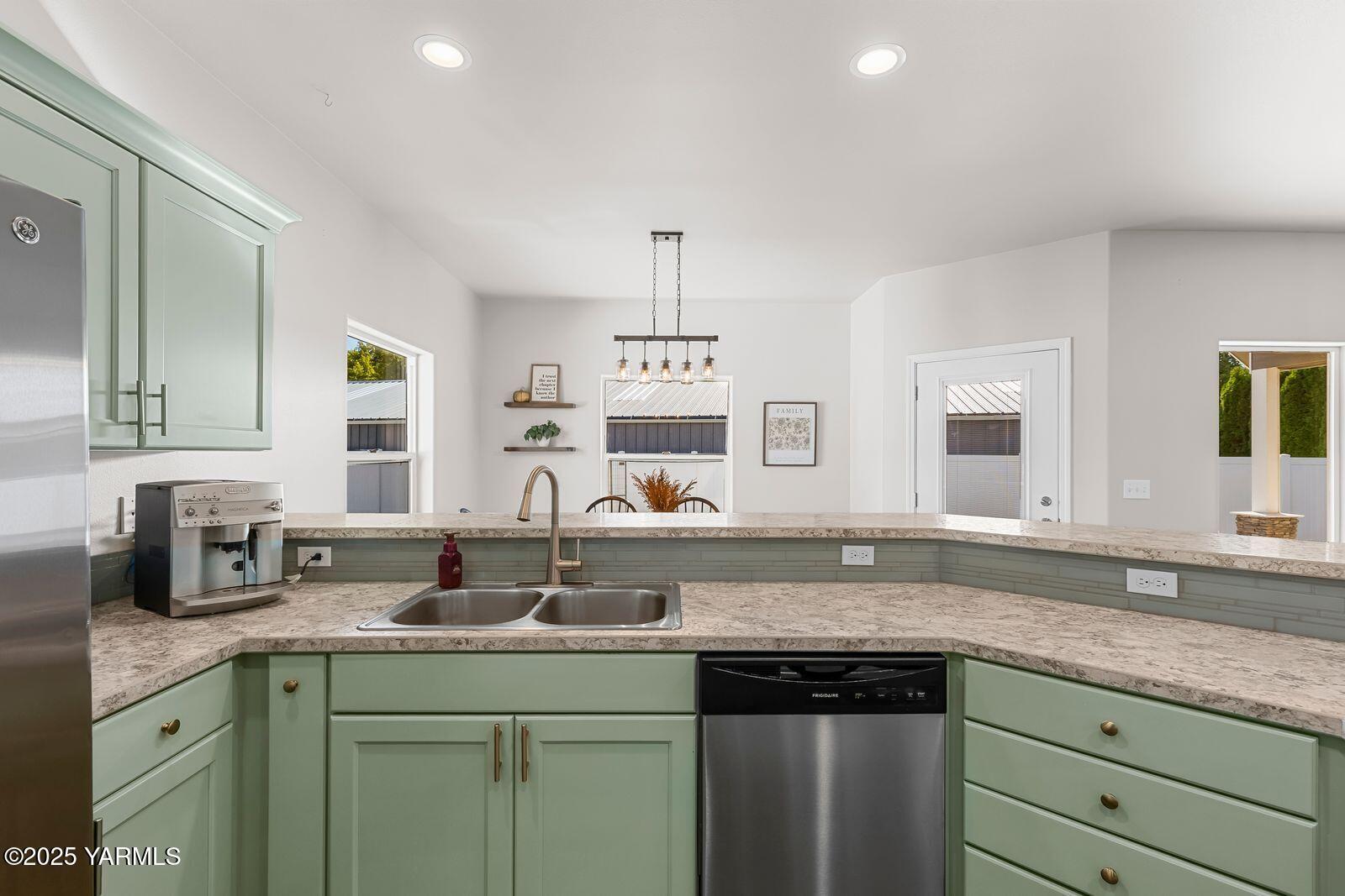 115 Apple Loop Naches, WA 98937 - Photo 15 of 48 a sink with granite countertop a sink and a white wooden cabinets