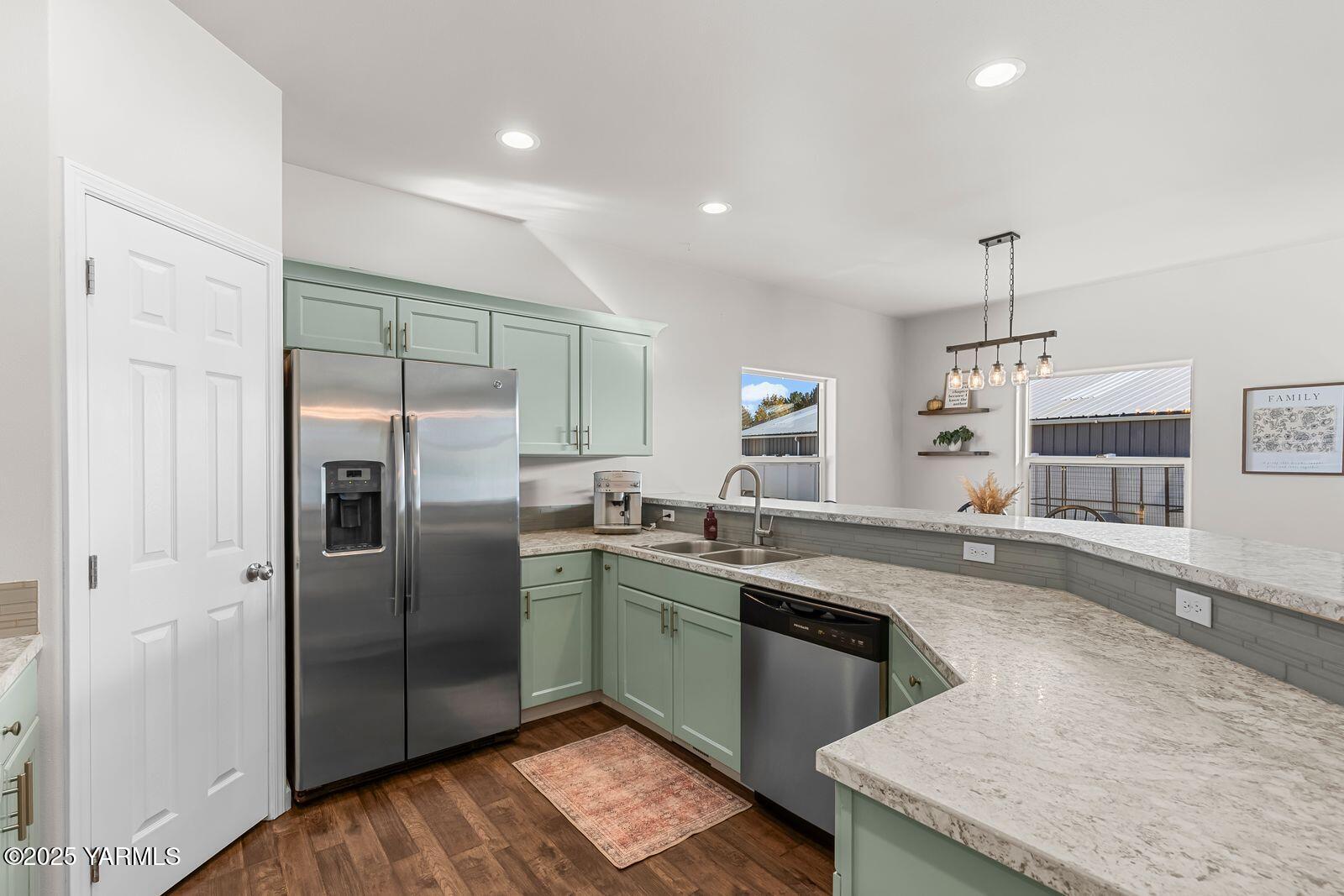 115 Apple Loop Naches, WA 98937 - Photo 16 of 48 a kitchen with granite countertop a sink stainless steel appliances and cabinets