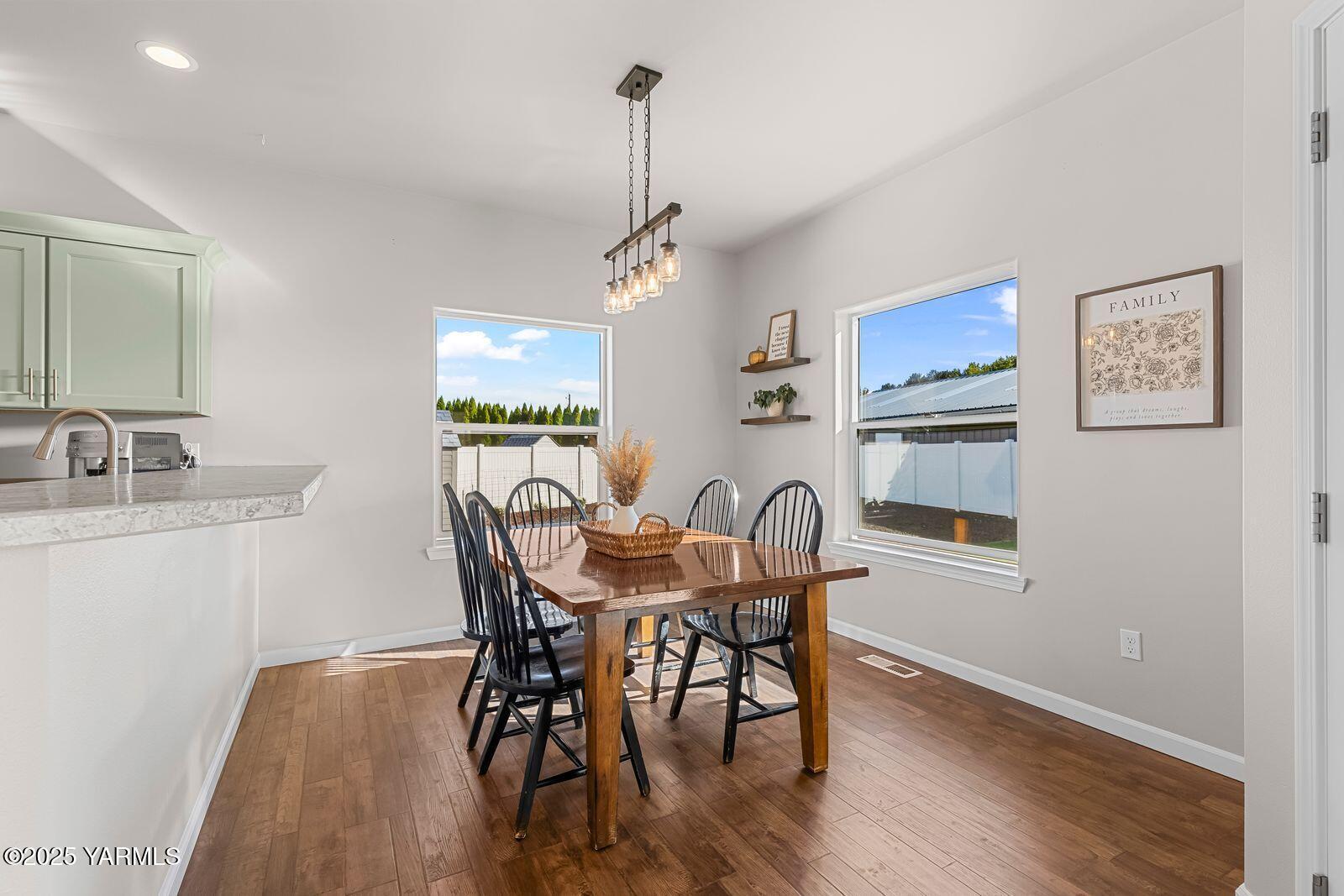 115 Apple Loop Naches, WA 98937 - Photo 17 of 48 a view of a dining room with furniture window and wooden floor