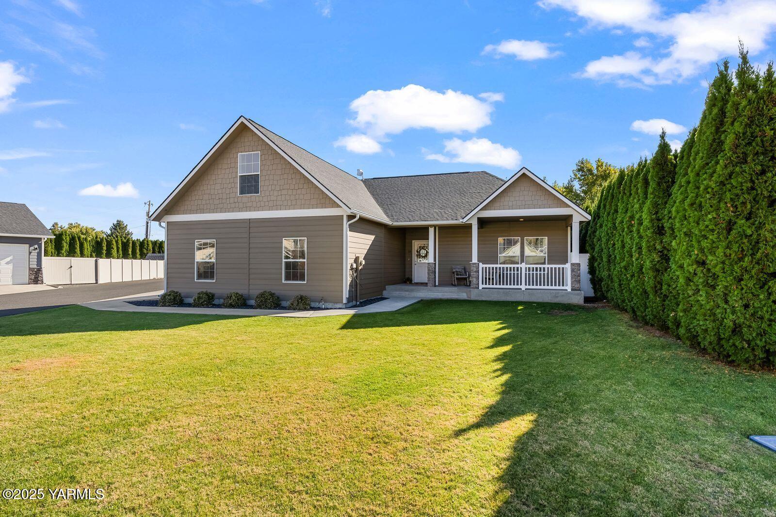 115 Apple Loop Naches, WA 98937 - Photo 2 of 48 a view of a house with swimming pool and a yard