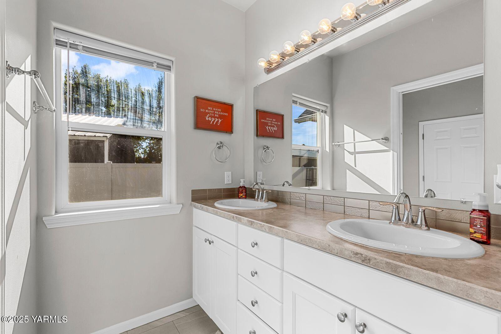 115 Apple Loop Naches, WA 98937 - Photo 24 of 48 a bathroom with a sink double vanity and a granite counter top