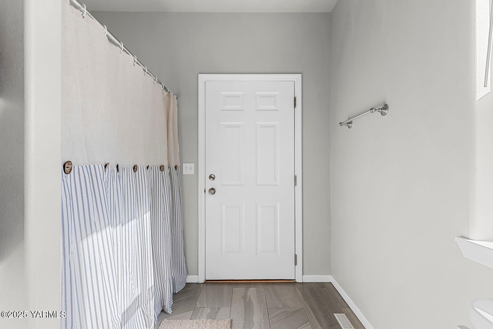 115 Apple Loop Naches, WA 98937 - Photo 26 of 48 a view of a hallway with wooden floor