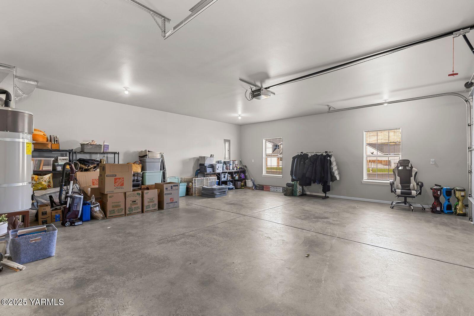 115 Apple Loop Naches, WA 98937 - Photo 28 of 48 a view of a garage with a bike and car