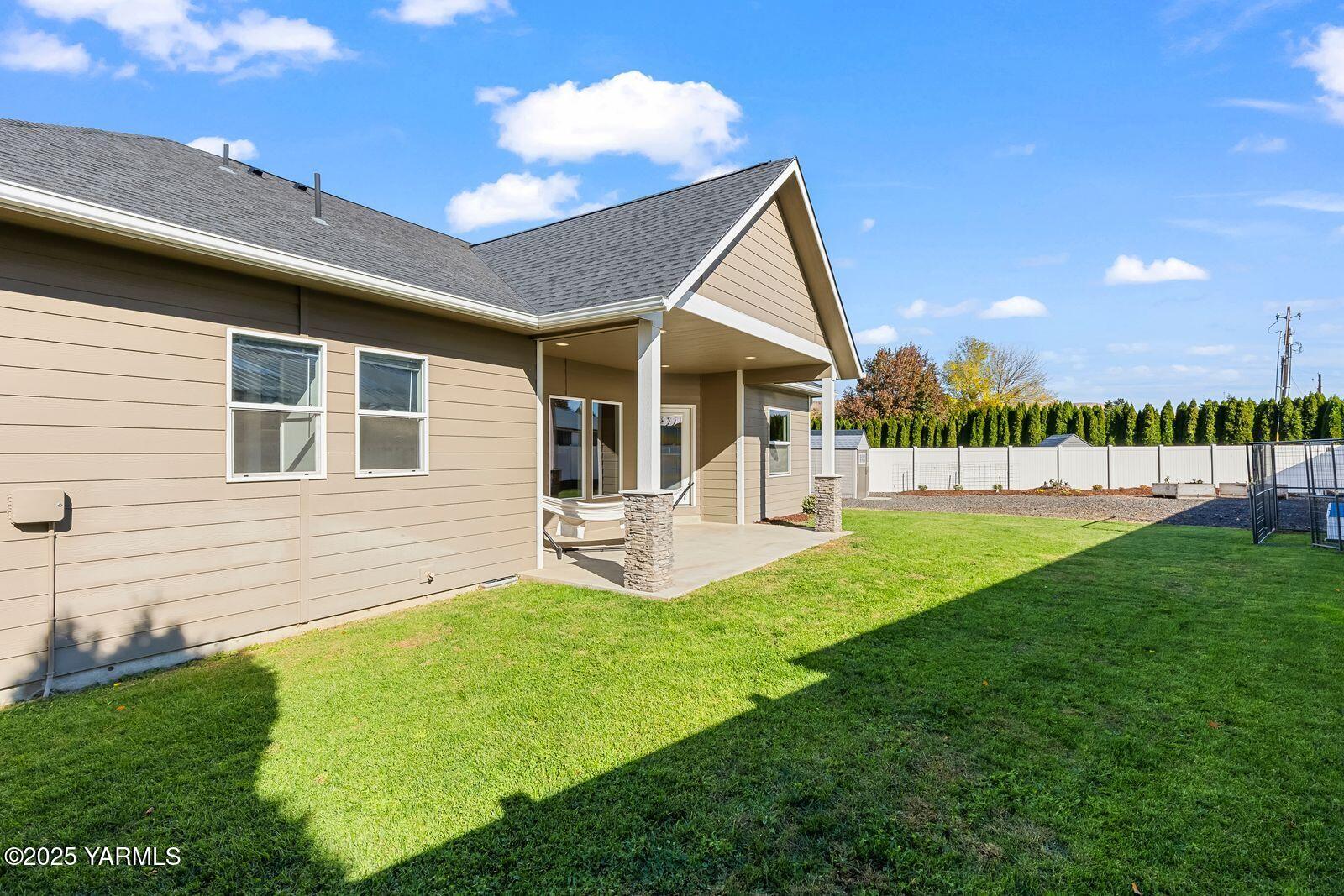 115 Apple Loop Naches, WA 98937 - Photo 33 of 48 a view of a house with a backyard