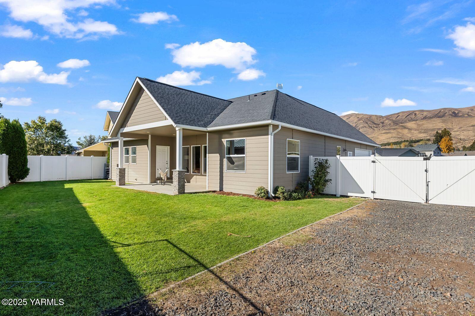 115 Apple Loop Naches, WA 98937 - Photo 34 of 48 a view of a house with a yard