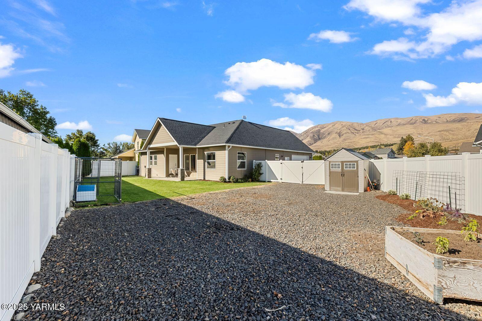115 Apple Loop Naches, WA 98937 - Photo 35 of 48 a house with trees in the background