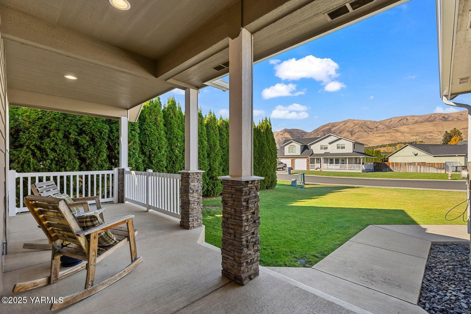 115 Apple Loop Naches, WA 98937 - Photo 4 of 48 a view of swimming pool with lawn chairs and iron fence