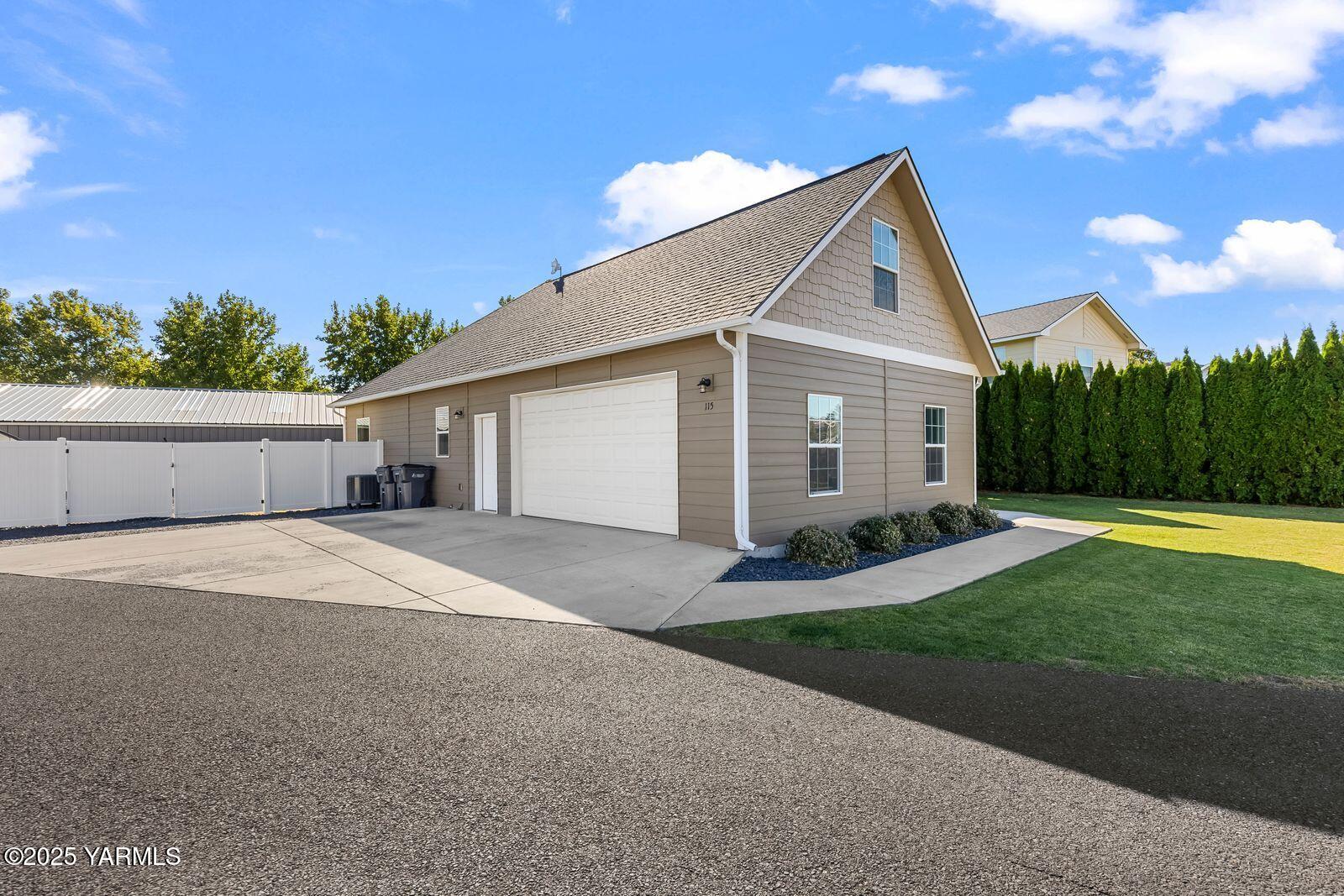 115 Apple Loop Naches, WA 98937 - Photo 6 of 48 a front view of house with yard and green space