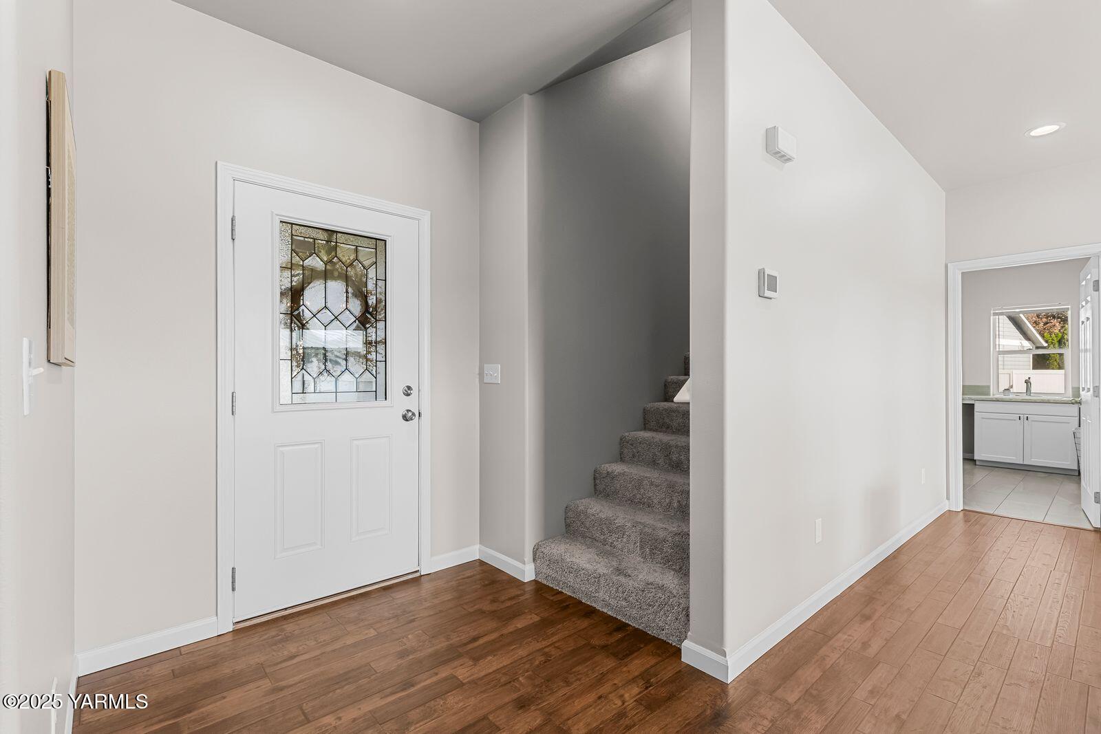 115 Apple Loop Naches, WA 98937 - Photo 7 of 48 a view of a hallway with wooden floor and closet