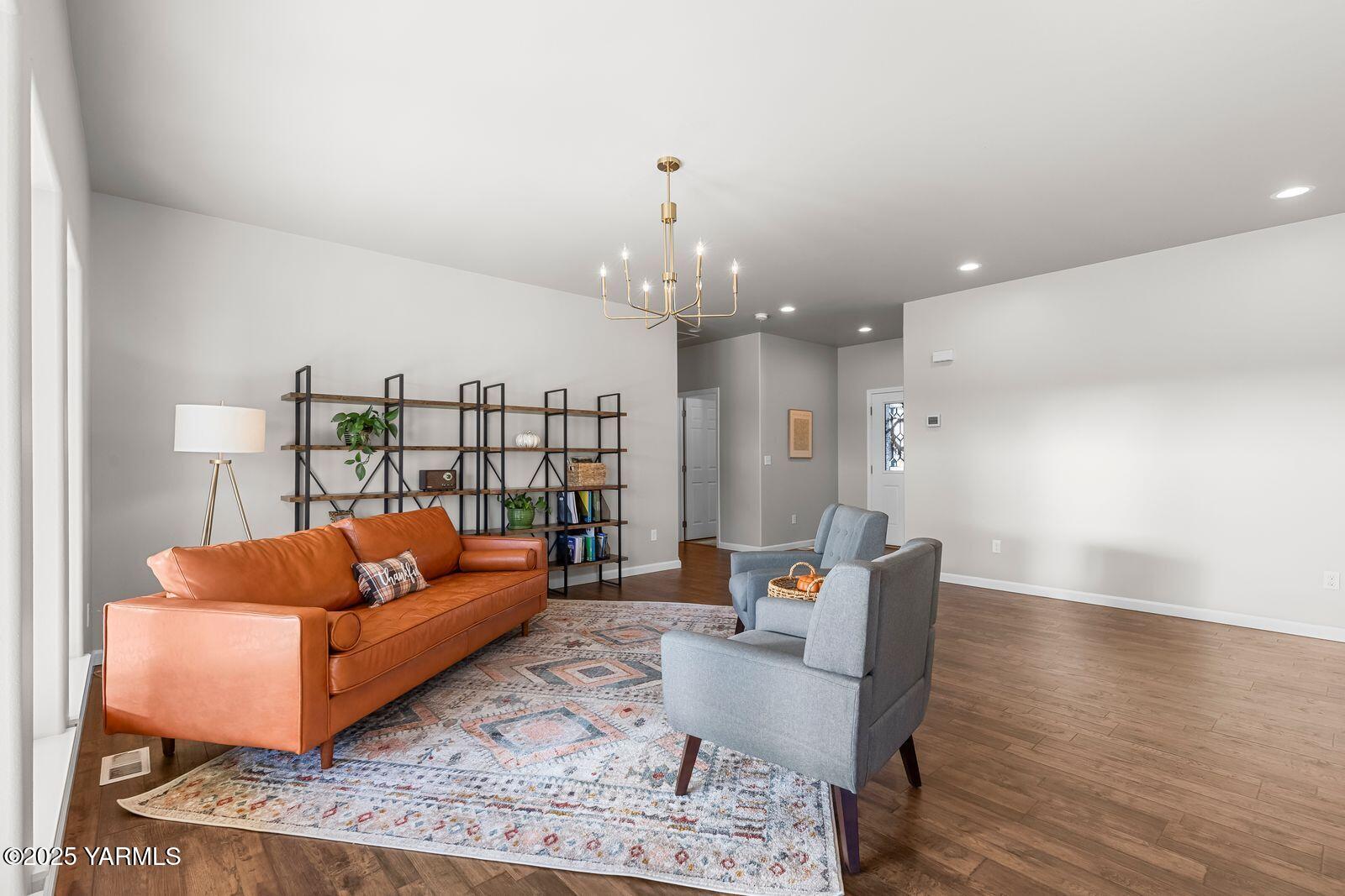 115 Apple Loop Naches, WA 98937 - Photo 9 of 48 a living room with furniture and a chandelier