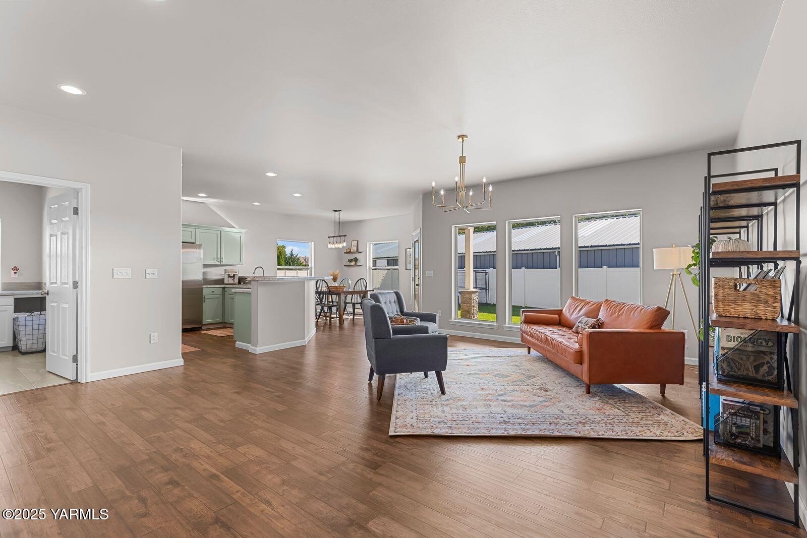 115 Apple Loop Naches, WA 98937 - Photo 10 of 48 a living room with furniture wooden floor and a kitchen view