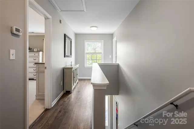 a view of entryway with wooden floor