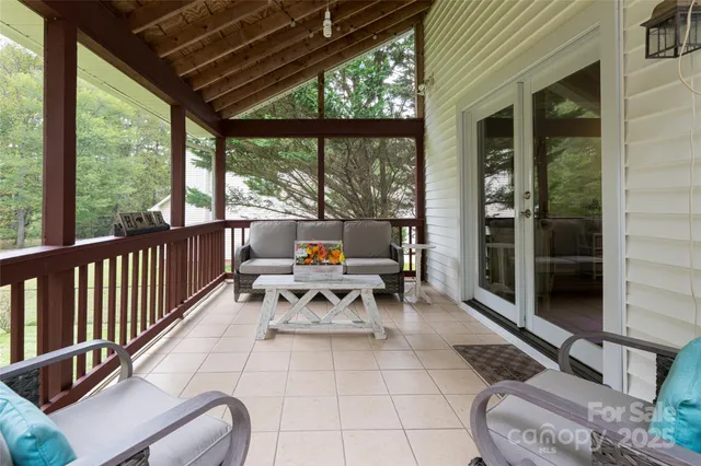 a view of a chairs and table in the balcony