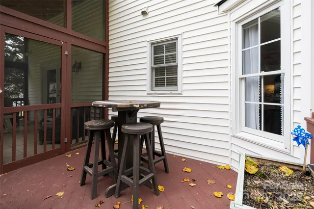 a view of a two chairs and table in the balcony
