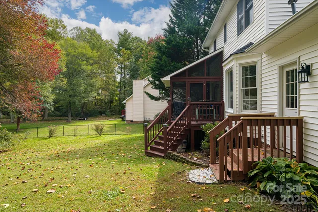 a view of a house with a small yard