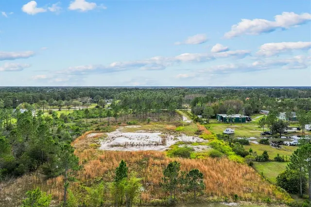 a view of a lake with a yard