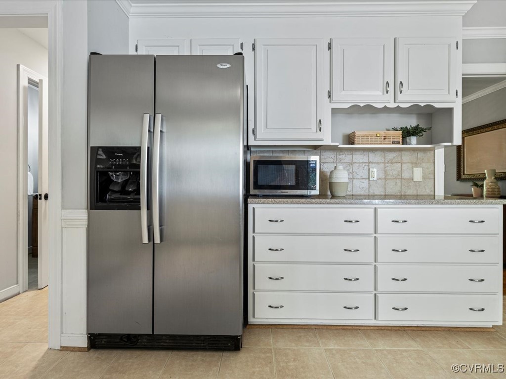 1519 Kingscross Road Midlothian, VA 23114 - Photo 29 of 50 a kitchen with white cabinets and stainless steel appliances