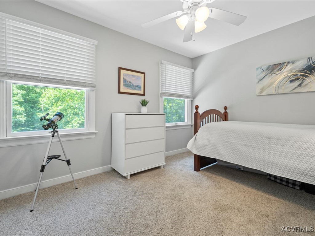 1519 Kingscross Road Midlothian, VA 23114 - Photo 39 of 50 a bedroom with a bed and a chandelier