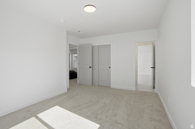11531 Engelmann Drive Draper, UT 84020 - Photo 25 of 31 Spacious room featuring light gray carpeting, white painted walls, and a contemporary ceiling light fixture