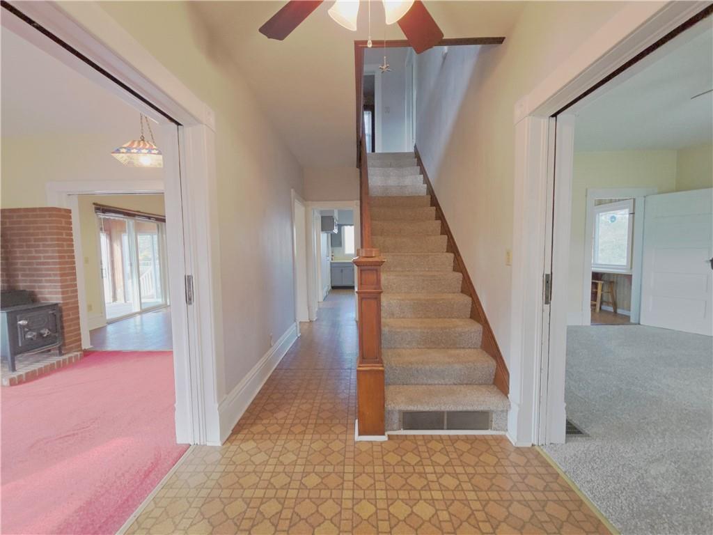 273 Government Road New Bethlehem, PA 16242 - Photo 2 of 33 a view of a hallway with wooden floor and staircase